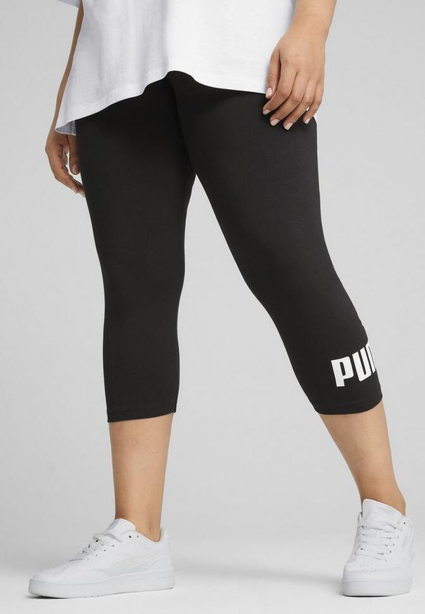 Puma - Damskie legginsy 3/4 z małym logo No. 1 ESS PUMA Black. Kolor: czarny. Materiał: guma. Wzór: nadruk