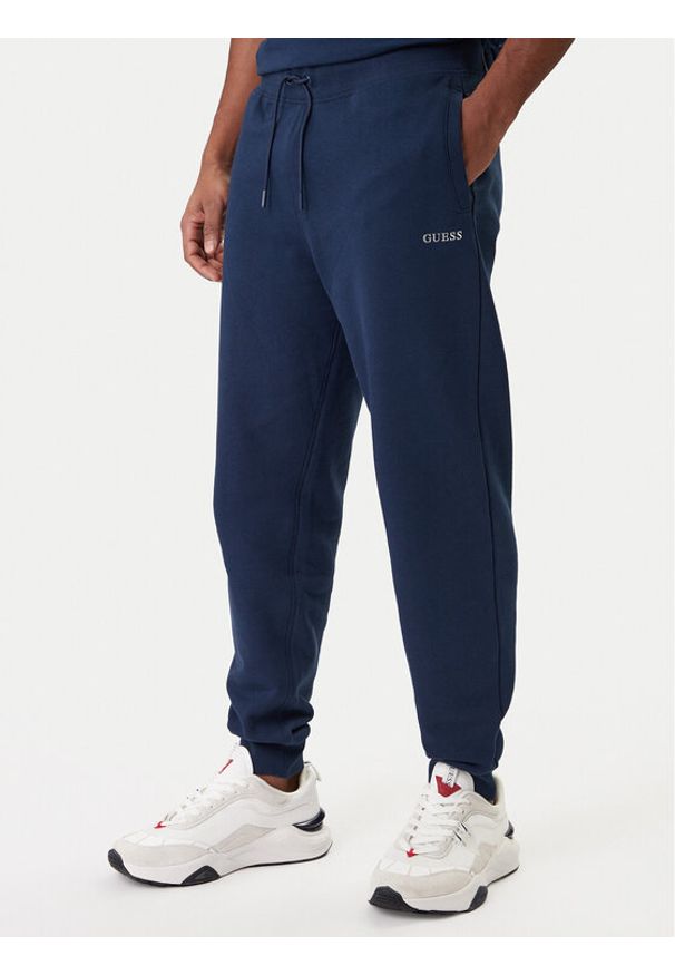 Guess Spodnie dresowe Z6RB12 KAIJ1 Granatowy Regular Fit. Kolor: niebieski. Materiał: bawełna