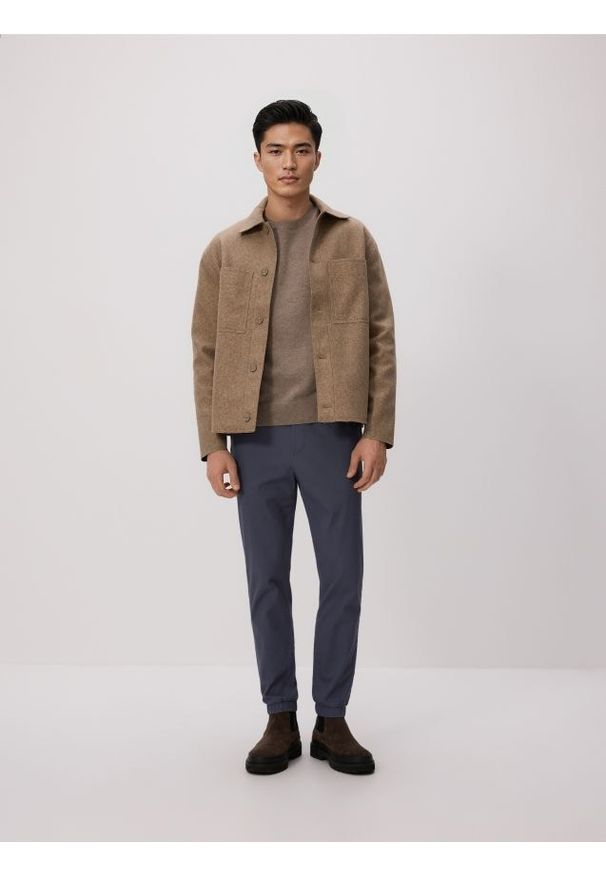 Reserved - Bawełniane spodnie jogger - granatowy. Kolor: niebieski. Materiał: bawełna