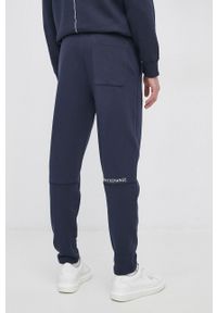 Armani Exchange Spodnie bawełniane męskie kolor granatowy z nadrukiem. Kolor: niebieski. Materiał: bawełna. Wzór: nadruk