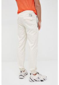 Sisley spodnie bawełniane męskie kolor beżowy joggery. Kolor: beżowy. Materiał: bawełna #3
