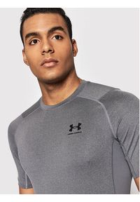 Under Armour Koszulka techniczna HeatGear® 1361518 Szary Slim Fit. Kolor: szary. Materiał: syntetyk
