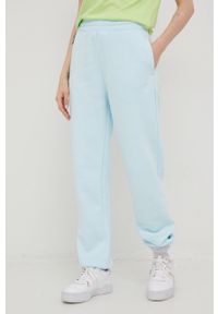 adidas Originals spodnie dresowe damskie gładkie. Kolor: niebieski. Materiał: dresówka. Wzór: gładki #1