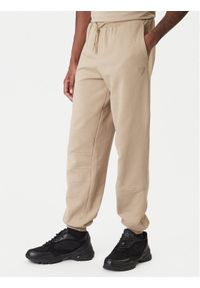 Guess Spodnie dresowe Z6RB03 K9YI1 Beżowy Regular Fit. Kolor: beżowy. Materiał: bawełna #1