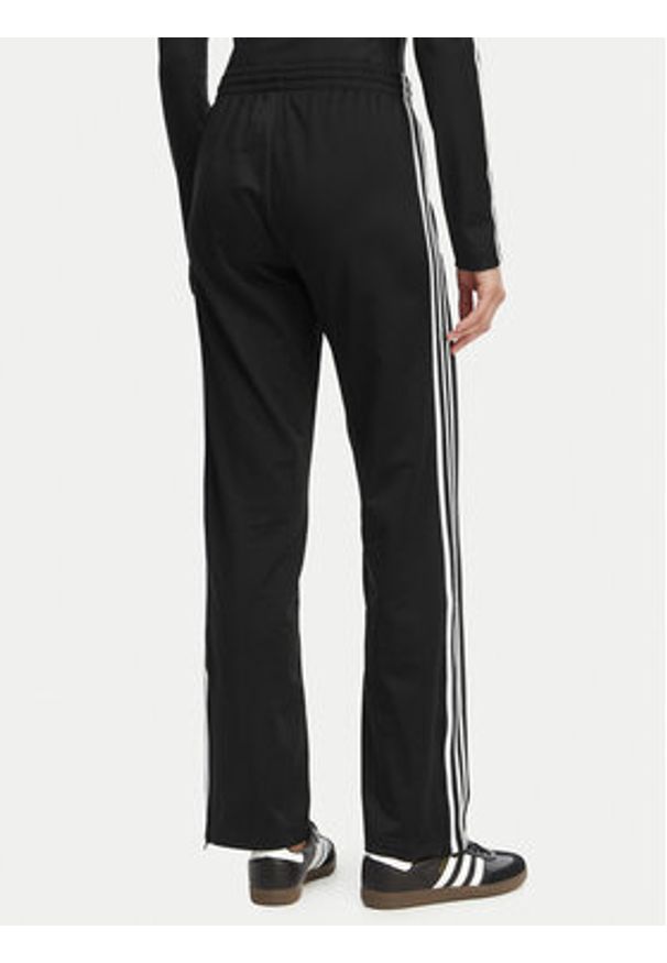 Adidas - adidas Spodnie dresowe Firebird Classic KD5575 Czarny Regular Fit. Kolor: czarny. Materiał: syntetyk
