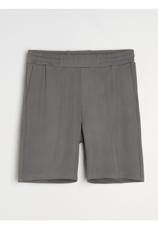 Sinsay - Szorty slim - niebieski. Kolor: niebieski