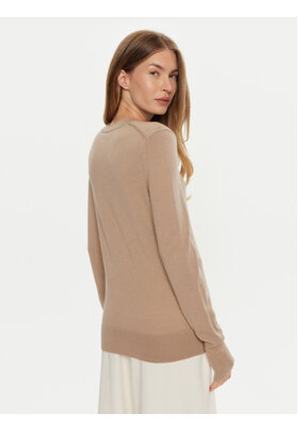 Calvin Klein Sweter K20K207452 Beżowy Regular Fit. Kolor: beżowy. Materiał: wełna