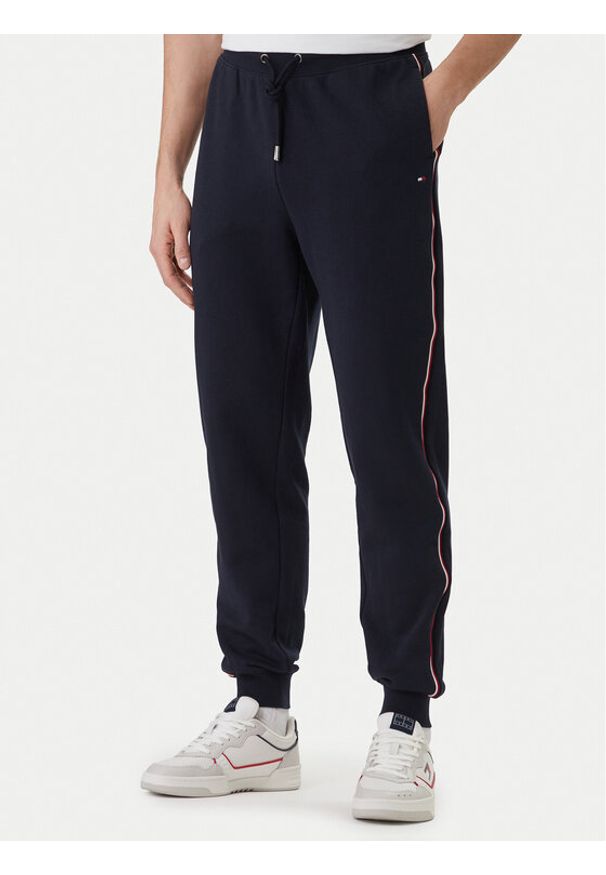 TOMMY HILFIGER - Tommy Hilfiger Spodnie dresowe Global Stripe MW0MW42882 Niebieski Regular Fit. Kolor: niebieski. Materiał: bawełna