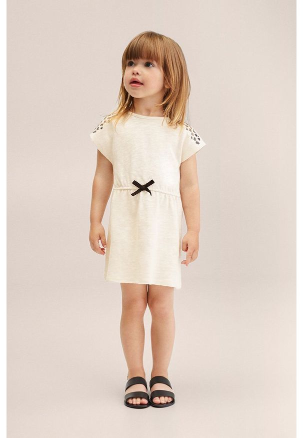 Mango Kids sukienka bawełniana dziecięca Morgana kolor beżowy mini prosta. Okazja: na co dzień. Kolor: beżowy. Materiał: bawełna. Długość rękawa: krótki rękaw. Wzór: aplikacja. Typ sukienki: proste. Styl: casual. Długość: mini