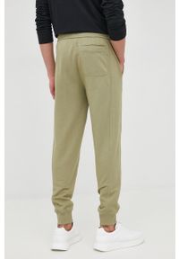 Calvin Klein Jeans spodnie bawełniane męskie kolor czarny gładkie. Kolor: zielony. Materiał: bawełna. Wzór: gładki