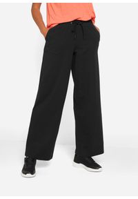 bonprix - Spodnie sportowe bawełniane, szerokie nogawki. Kolor: czarny. Materiał: bawełna. Styl: sportowy