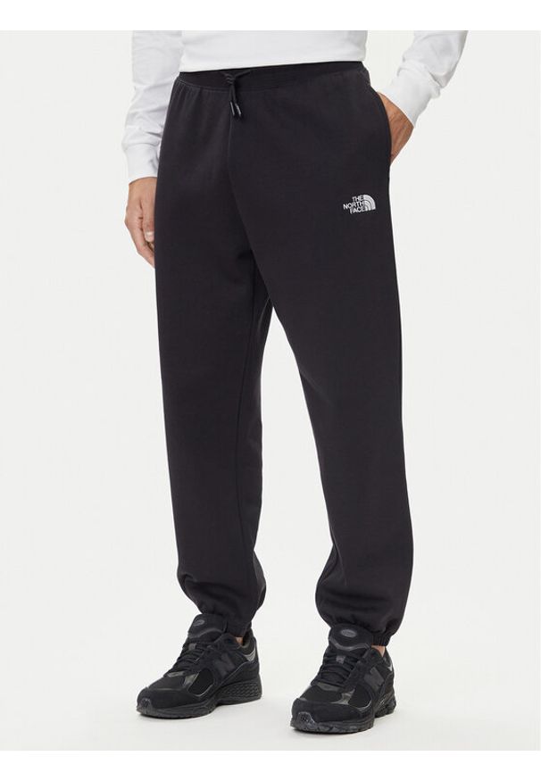 The North Face Spodnie dresowe Essential NF0A8C1F Czarny Relaxed Fit. Kolor: czarny. Materiał: bawełna