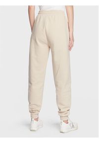 Calvin Klein Jeans Spodnie dresowe J20J220676 Beżowy Regular Fit. Kolor: beżowy. Materiał: dresówka, bawełna