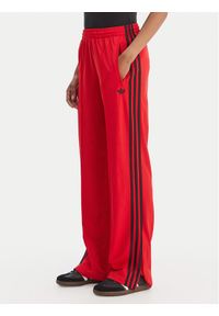 Adidas - adidas Spodnie dresowe Firebird Classic KD3648 Czerwony Regular Fit. Kolor: czerwony. Materiał: syntetyk #1
