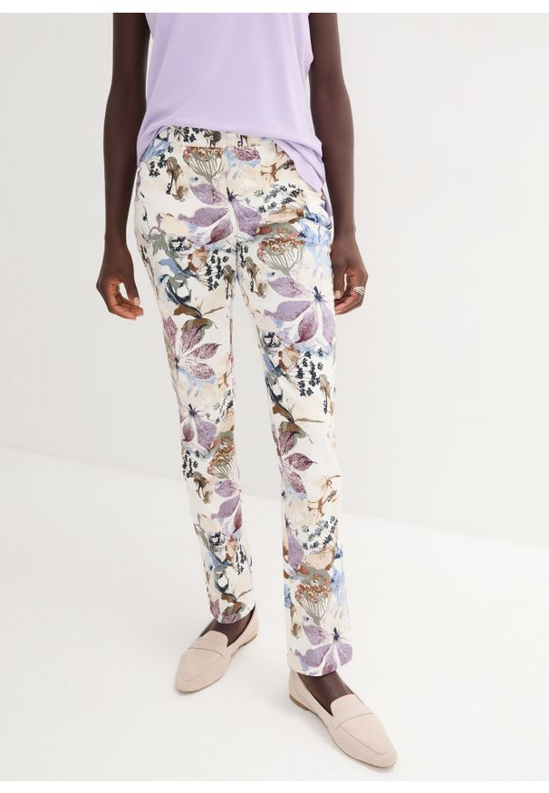 bonprix - Spodnie ze stretchem w kwiaty. Kolor: beżowy. Wzór: kwiaty