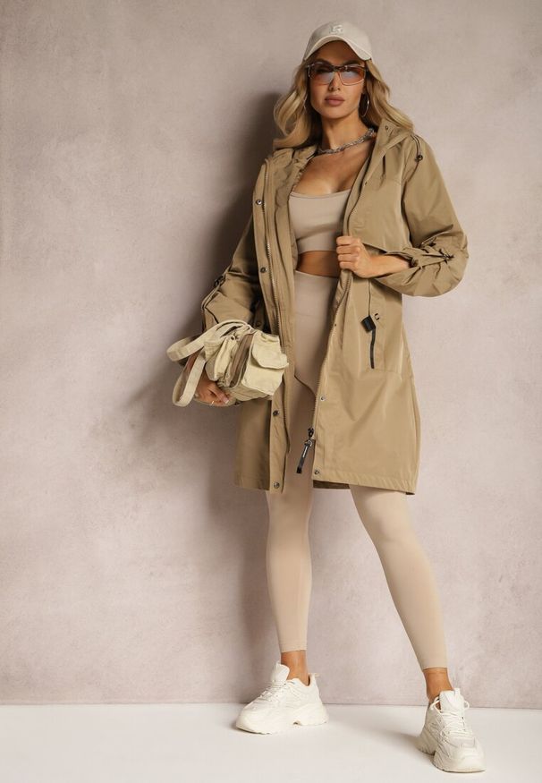 Renee - Ciemnobeżowa Kurtka Przejściowa w Stylu Parki z Paskiem w Talii Lumoria. Okazja: na co dzień, na spacer. Kolor: beżowy. Styl: elegancki, casual
