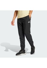 Adidas - Spodnie Essentials Small Logo Stanford. Kolor: czarny, biały, wielokolorowy. Materiał: materiał. Sport: fitness