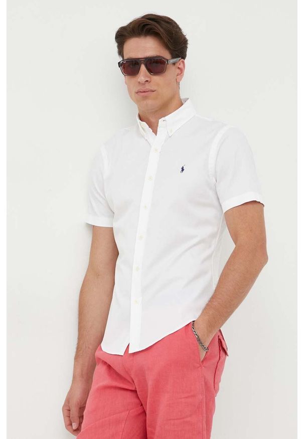 Polo Ralph Lauren koszula bawełniana męska kolor biały regular z kołnierzykiem button-down. Okazja: na co dzień. Typ kołnierza: button down, polo. Kolor: biały. Materiał: bawełna. Długość rękawa: krótki rękaw. Długość: krótkie. Wzór: aplikacja. Styl: casual