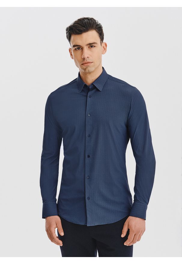 Pako Lorente - PAKO LORENTE – Granatowa dzianinowa koszula w jodełkę. Typ kołnierza: kołnierzyk klasyczny. Kolor: niebieski. Materiał: dzianina. Długość rękawa: długi rękaw. Długość: długie. Wzór: jodełka. Styl: klasyczny