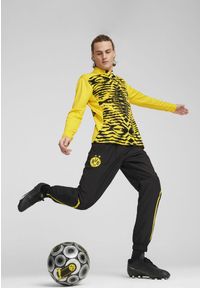 Puma - Męska bluza przedmeczowa z zamkiem 1/4 Borussia Dortmund PUMA. Kolor: czarny, wielokolorowy, żółty