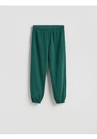 Reserved - Spodnie dresowe z bawełną - ciemnozielony. Kolor: zielony. Materiał: bawełna, dresówka