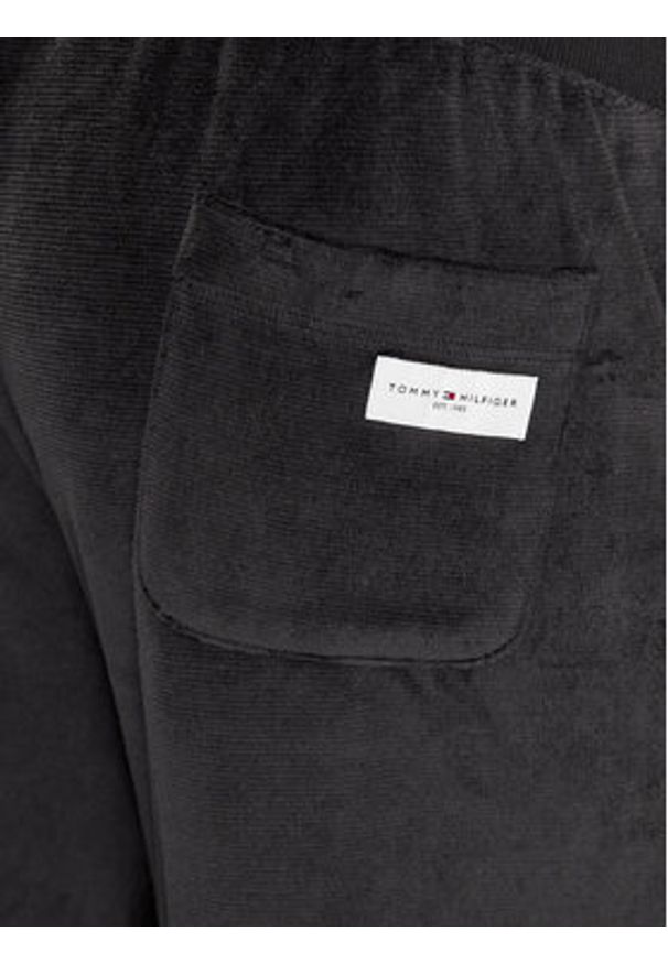 TOMMY HILFIGER - Tommy Hilfiger Spodnie dresowe UM0UM03014 Czarny Regular Fit. Kolor: czarny. Materiał: syntetyk, bawełna