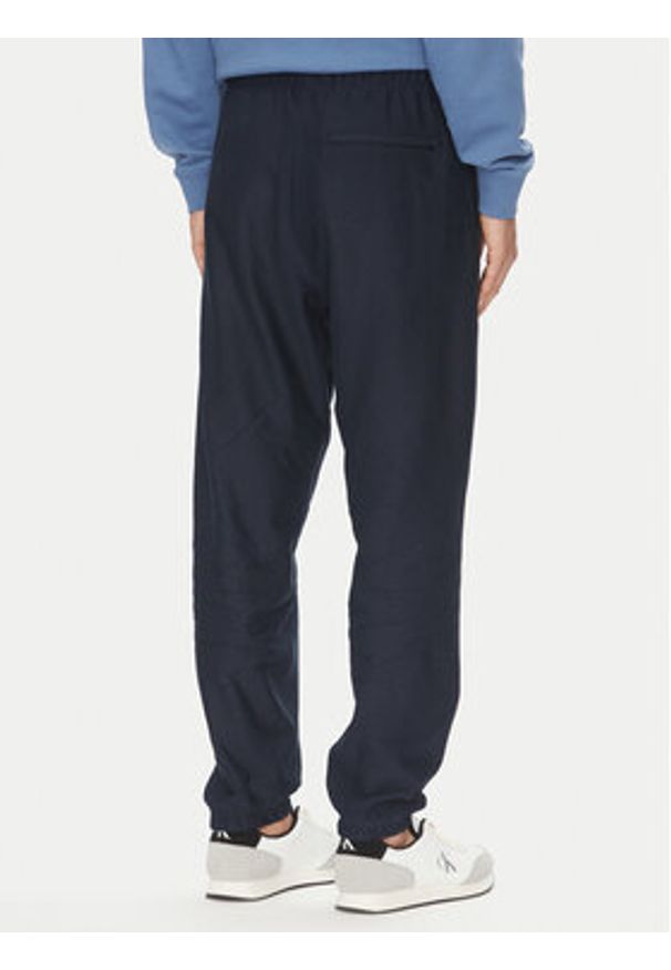 Calvin Klein Jeans Spodnie dresowe Premium LV04RC279G Granatowy Regular Fit. Kolor: niebieski. Materiał: bawełna