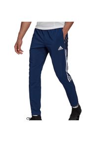 Adidas - Spodnie adidas Tiro 21 Woven M GH4470. Kolor: wielokolorowy, niebieski, biały