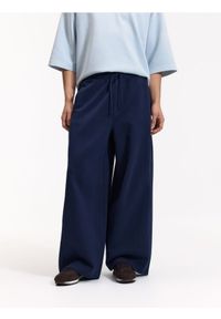 Reserved - Spodnie loose fit - granatowy. Kolor: niebieski. Materiał: dzianina, bawełna #1