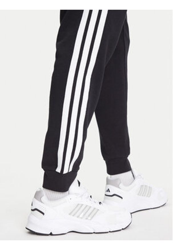 Adidas - adidas Spodnie dresowe Essential 3-Stripes JD1881 Czarny Regular Fit. Kolor: czarny. Materiał: bawełna, syntetyk