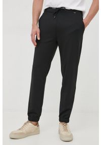 Calvin Klein spodnie dresowe męskie kolor czarny gładkie. Kolor: czarny. Materiał: dresówka. Wzór: gładki