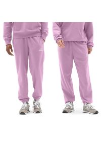 Spodnie New Balance UP21500LLC - różowe. Kolor: różowy. Materiał: materiał, dresówka. Sport: fitness