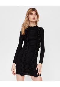 NEEDLE & THREAD - Czarna sukienka z falbaną. Kolor: czarny. Materiał: welur, materiał. Długość rękawa: długi rękaw. Wzór: aplikacja. Typ sukienki: dopasowane #1
