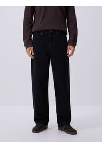 Reserved - Jeansy baggy tapered - czarny. Kolor: czarny