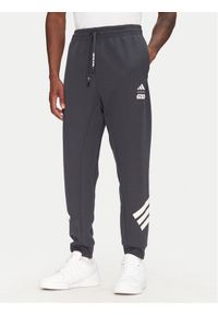 Adidas - adidas Spodnie dresowe Star Wars The Mandalorian™ JI5724 Szary Regular Fit. Kolor: szary. Materiał: bawełna, syntetyk. Wzór: motyw z bajki #1