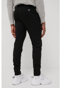 Champion spodnie Rib Cuff męskie kolor czarny z aplikacją. Kolor: czarny. Materiał: dzianina. Wzór: aplikacja