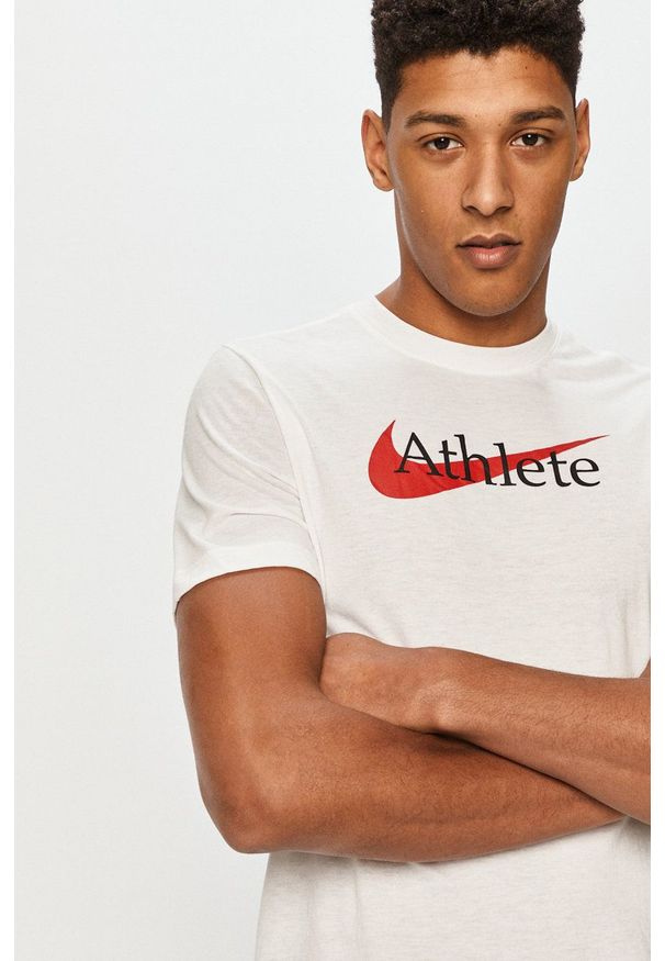 Nike - T-shirt. Okazja: na co dzień. Kolor: biały. Materiał: tkanina, dzianina, skóra, włókno. Wzór: nadruk. Styl: casual