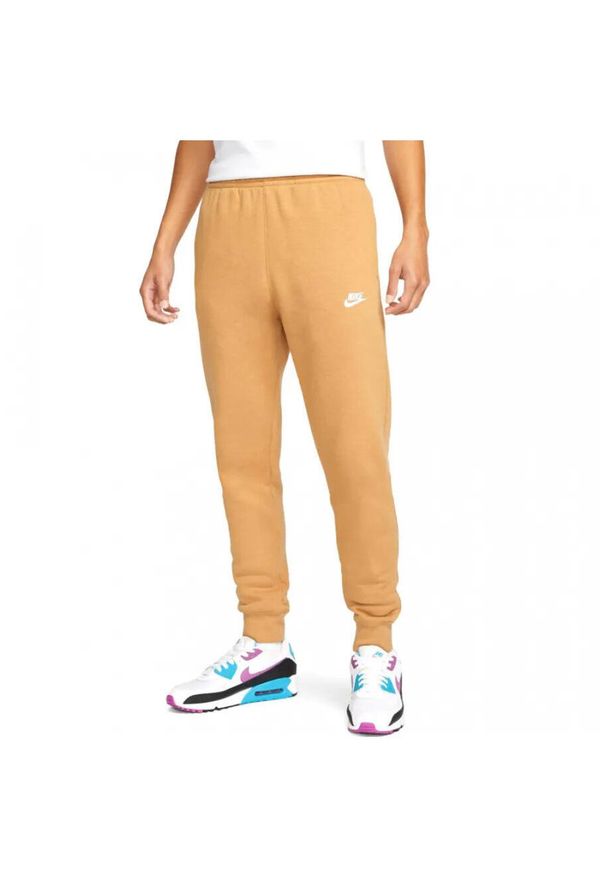 Spodnie męskie Nike NSW Club. Kolor: pomarańczowy. Materiał: materiał. Sport: joga i pilates