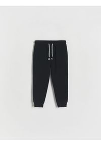 Reserved - Spodnie dresowe jogger - czarny. Kolor: czarny. Materiał: dresówka #1