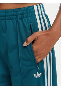 Adidas - adidas Spodnie dresowe Firebird Loose Tracksuit KS4672 Turkusowy Loose Fit. Kolor: turkusowy. Materiał: syntetyk #2