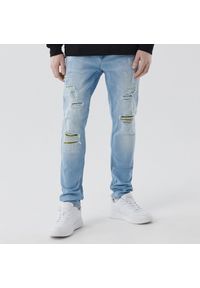 Cropp - Męskie jeansy skinny z przetarciami - Niebieski. Kolor: niebieski #1