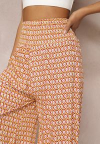 Renee - Żółto-Pomarańczowe Szerokie Spodnie z Wiskozy z Marszczoną Gumką w Talii Mellody. Kolor: żółty. Materiał: wiskoza. Styl: boho #3