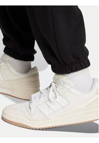 Adidas - adidas Spodnie dresowe Premium Essentials IY2245 Czarny Loose Fit. Kolor: czarny. Materiał: bawełna #4