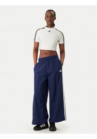 Adidas - adidas Spodnie dresowe Essentials 3-Stripes JV5328 Granatowy Loose Fit. Kolor: niebieski. Materiał: syntetyk #5