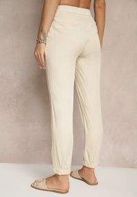 Renee - Jasnobeżowe Spodnie Dresowe High Waist z Ozdobnym Wiązaniem Ellivaria. Okazja: na co dzień. Stan: podwyższony. Kolor: beżowy. Materiał: dresówka. Styl: casual #5