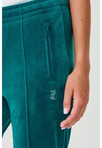 Juicy Couture - JUICY COUTURE Turkusowe spodnie Tina. Kolor: niebieski. Materiał: poliester. Wzór: aplikacja #6