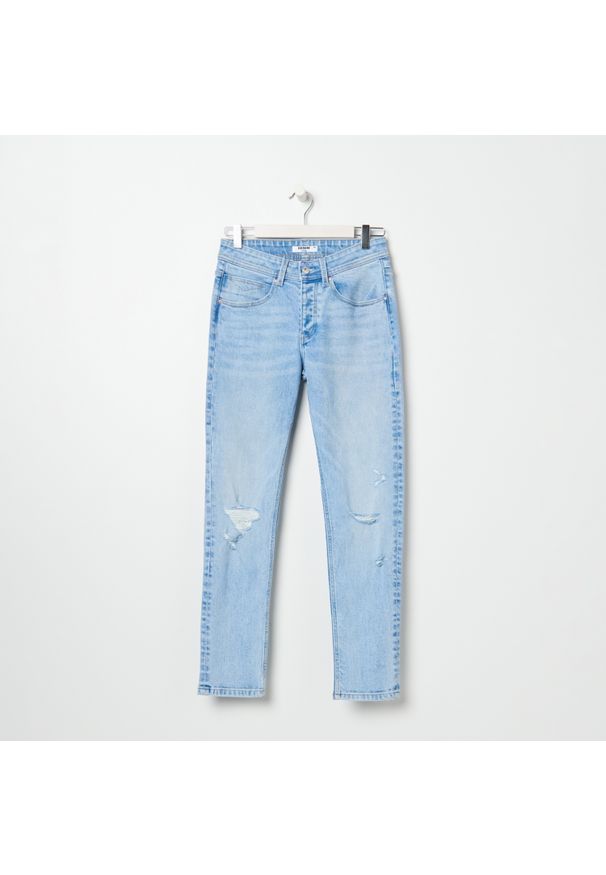 Sinsay - Spodnie jeansowe z przetarciami - Niebieski. Kolor: niebieski