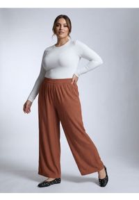 Sinsay - Wiskozowe spodnie wide leg Plus Size - żółty. Kolekcja: plus size. Kolor: żółty