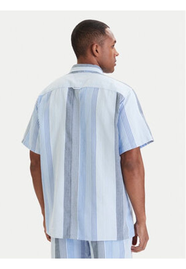 Tommy Jeans Koszula DM0DM22789 Błękitny Relaxed Fit. Kolor: niebieski. Materiał: bawełna