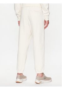 New Balance Spodnie dresowe MP23551 Écru Relaxed Fit. Materiał: bawełna